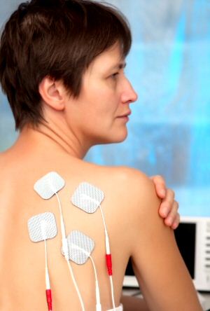 Ultrasound patient wearing TENS patches